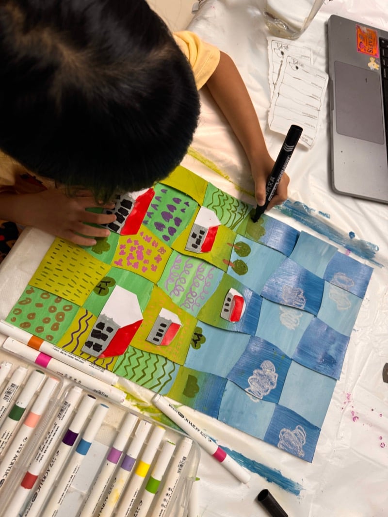 Children painting with watercolours in an Art by Ancourage studio class